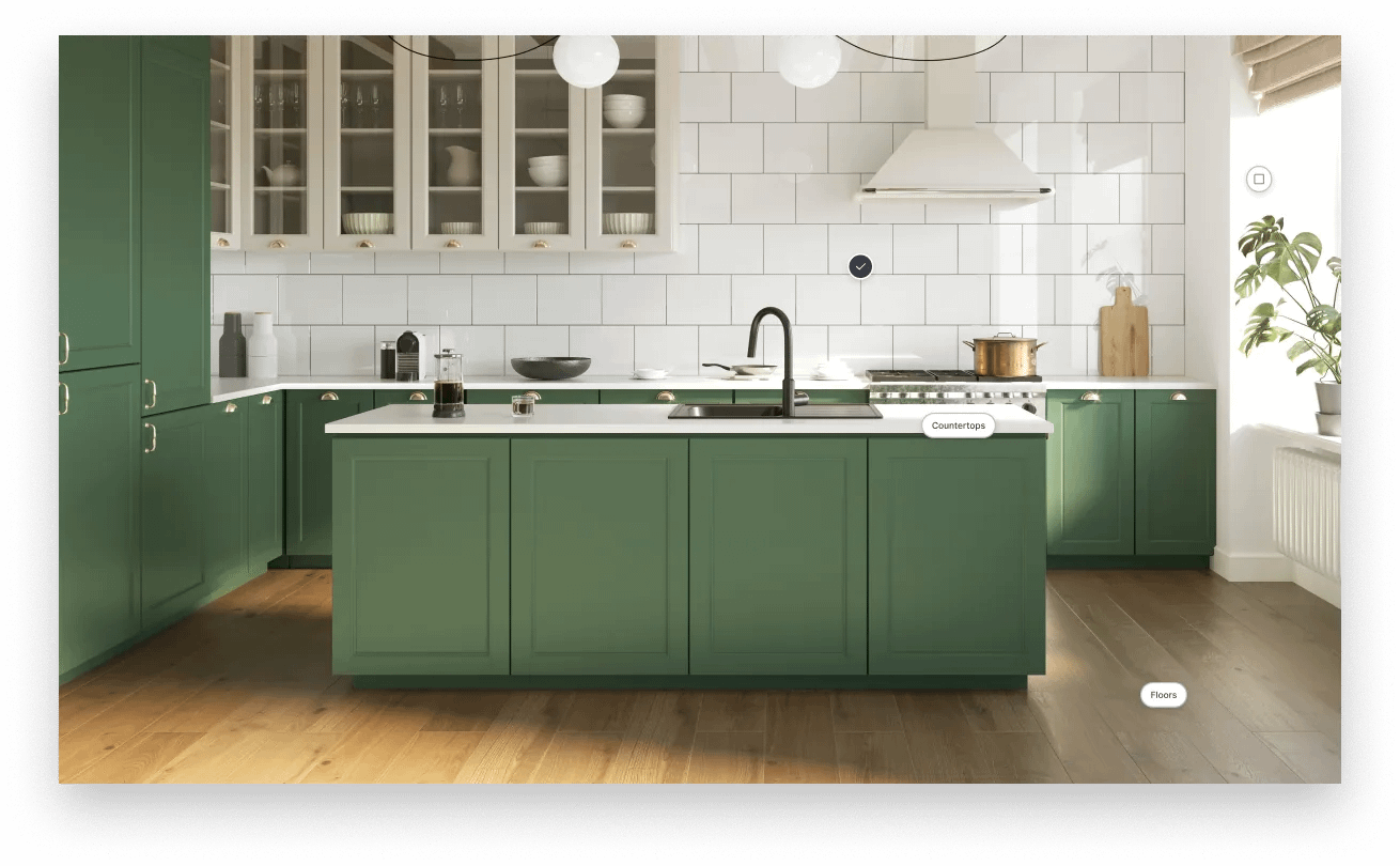 Image of wooden Roomvo kitchen floor with green kitchen cabinets